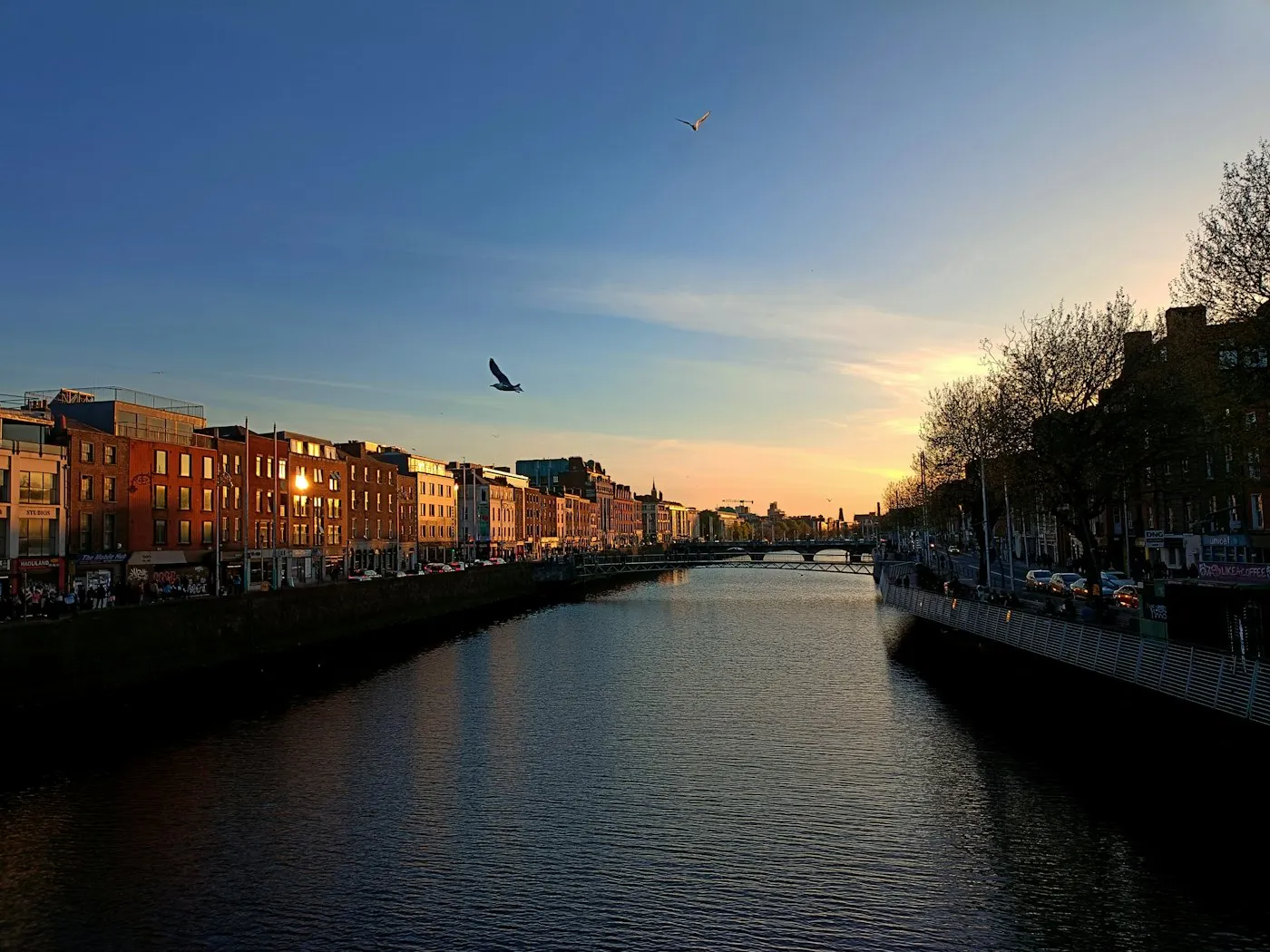A river running through an Irish city with buildings along both banks