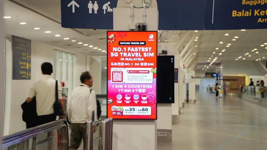 A digital advertising screen inside an airport terminal