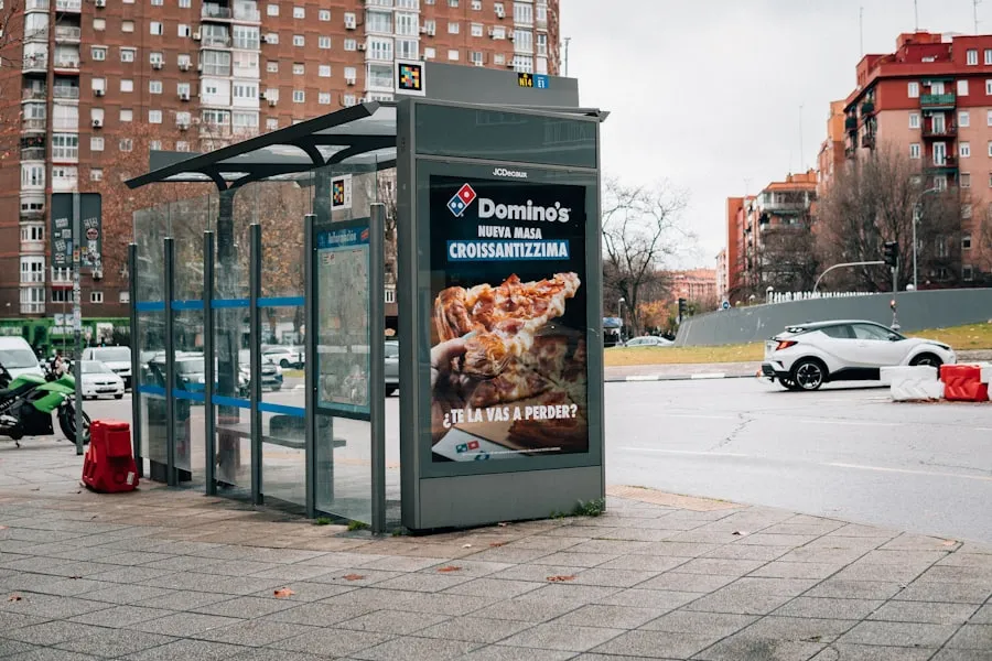 A city bus shelter carrying a printed advertisement